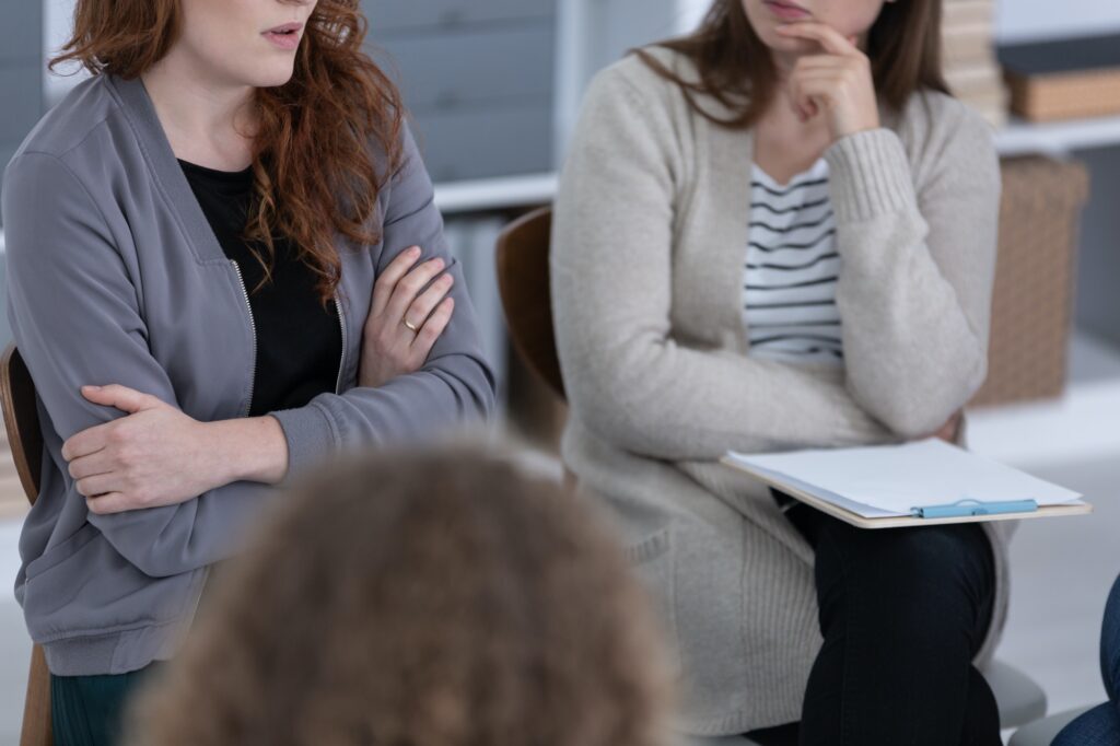 Group of women supporting each other at therapy session