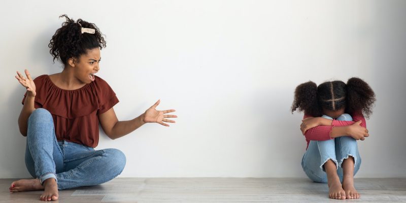 Mad black lady shouting at her crying female kid