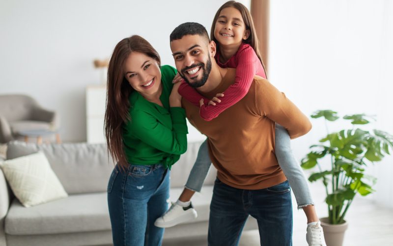 Portrait of cheerful happy Arab family having fun at home